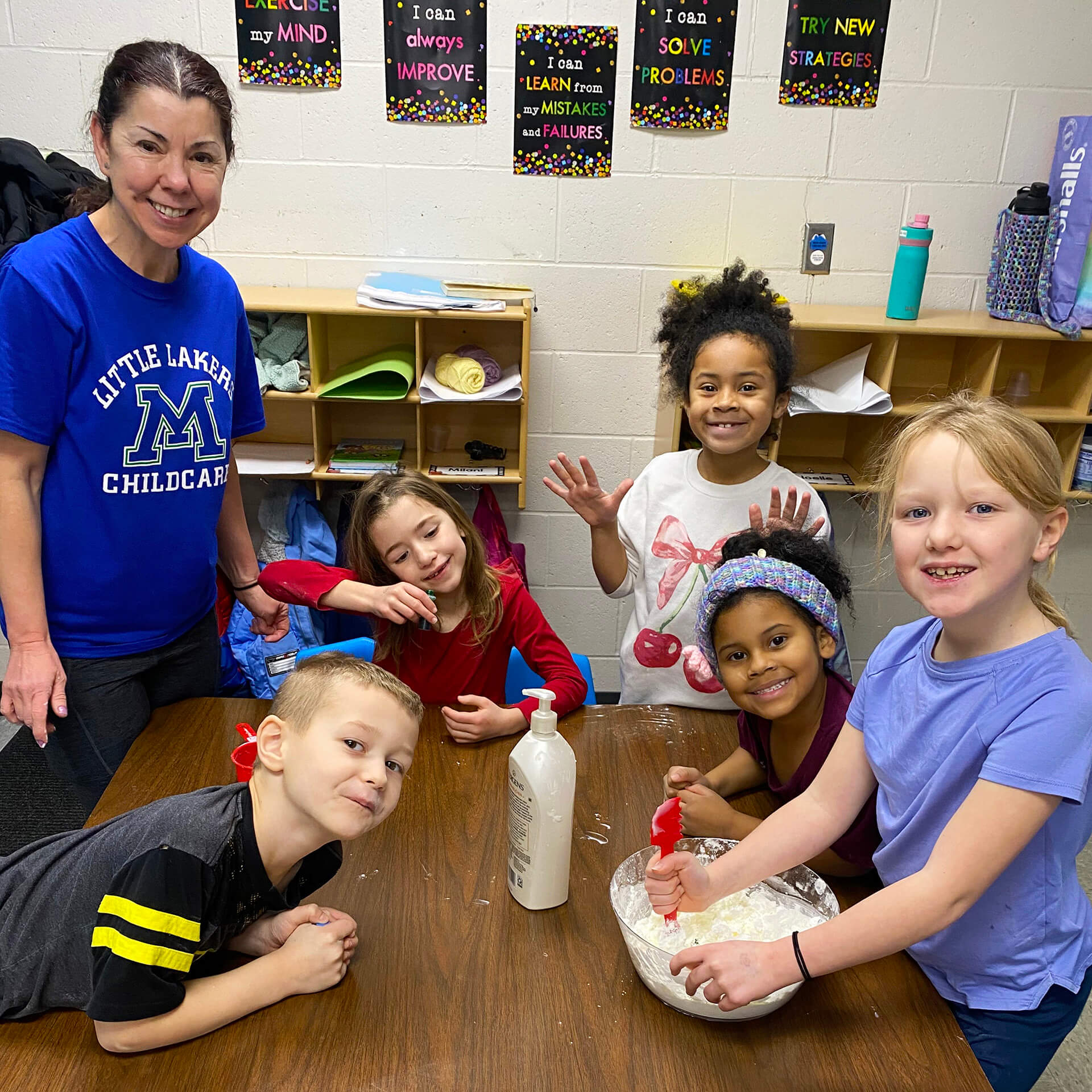 Teacher and children working on an experiment
